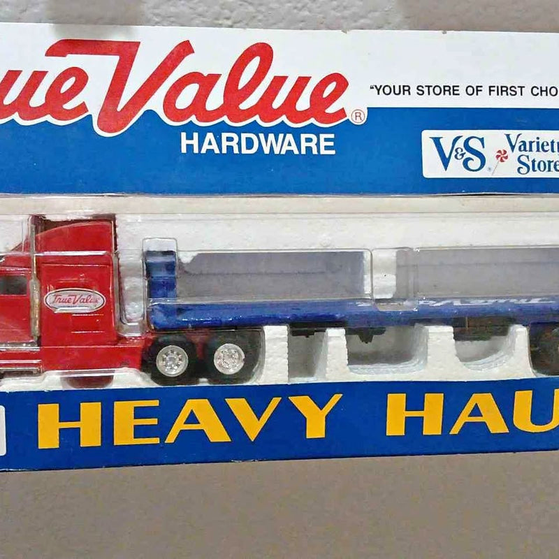 True Value diecast heavy hauler toy truck, red and blue cab with silver wheels
