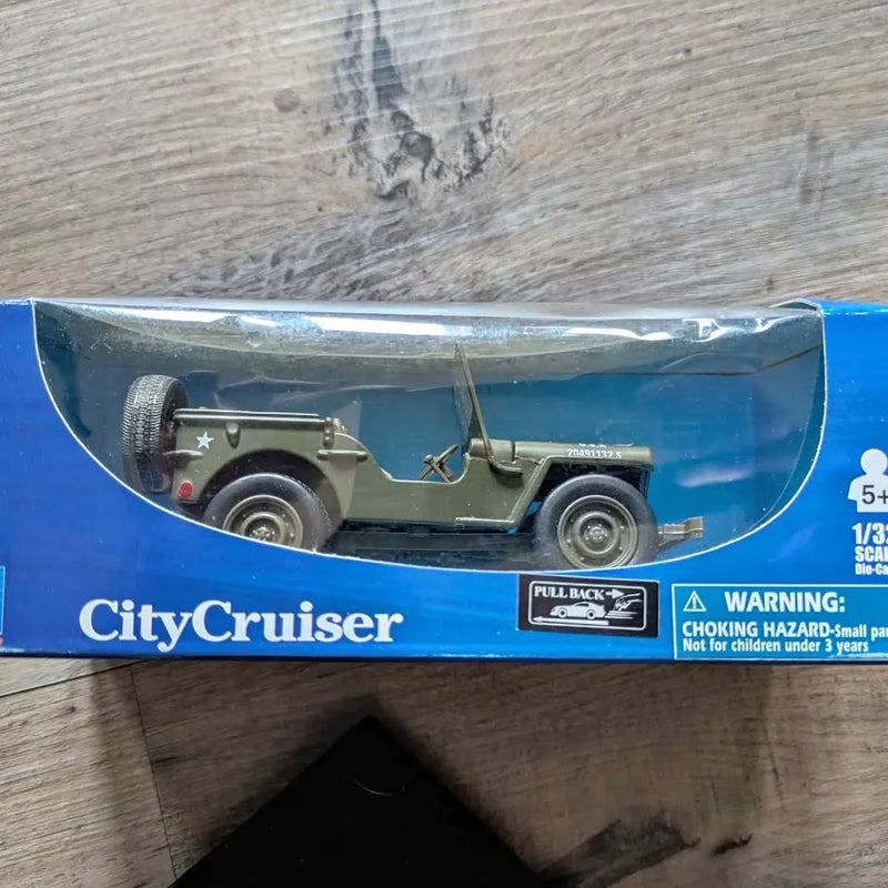 Olive green Jeep Willys-style diecast toy car in retail box, 1/32 scale