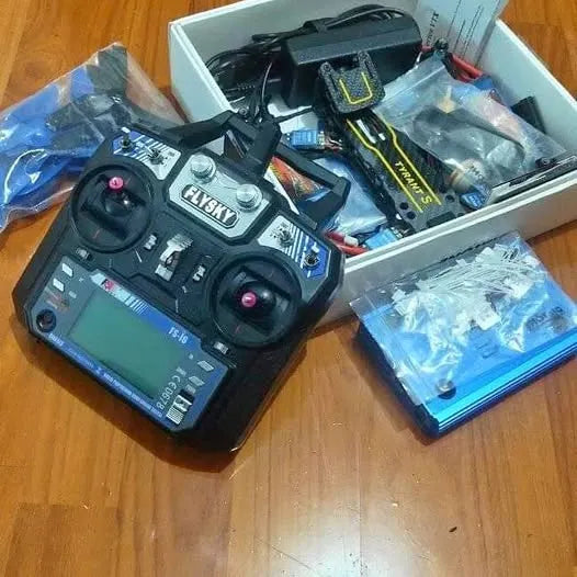 Drone controller transmitter with dual joysticks, screen, and antenna