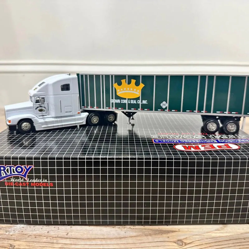 White diecast semi truck with blue striped trailer and Crown Cork & Seal logos
