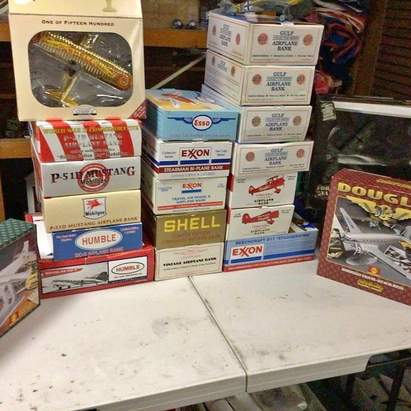 Diecast metal airplane boxed collectibles, stacked packaging with multiple aircraft labels