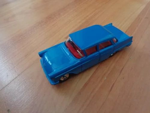 Blue diecast classic Opel Kapitan toy car, side view
