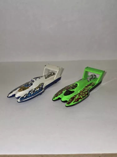 Diecast hydroplane boats, white and green with detailed decals