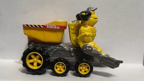 Yellow and black diecast dump truck with robot figure cab, wheel details and front scoop