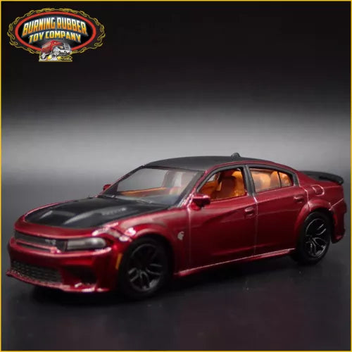 Red die-cast model car, 4-door sedan, front three-quarter view