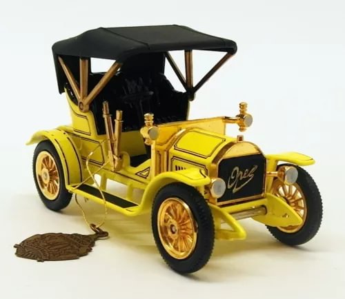 Vintage yellow diecast model car with open top and gold details