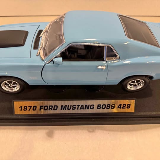 Diecast 1970 Ford Mustang Boss 429 light blue car, side view with open hood