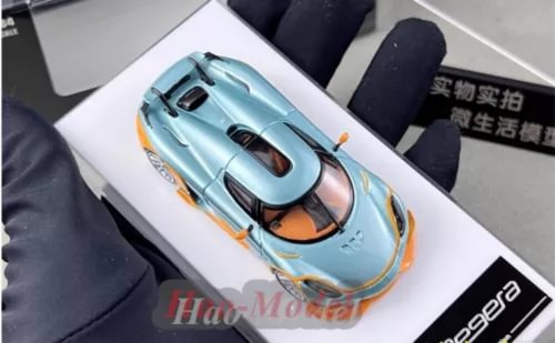 Koenigsegg Regera 1/64 diecast supercar model toy in light blue with orange accents