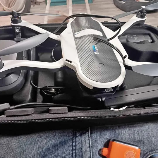 Arkadelphia AR drone with white control module and connected cables, close-up