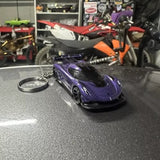 Purple diecast sports car keychain with metal keyring and circular tag