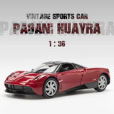 Red alloy pull-back sports car model, front 3/4 view