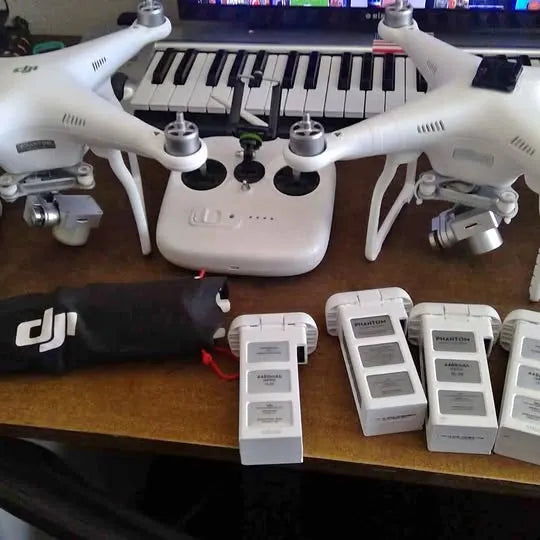 White quadcopter drone with propellers and central camera mount