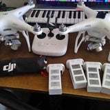 White quadcopter drone with propellers and central camera mount