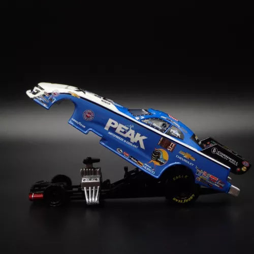 Blue and white NHRA funny car diecast model, side view, 1:64 scale.