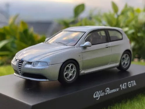 Silver 1/64 diecast car model with Alfa Romeo 147 GTA badge, front three-quarter view