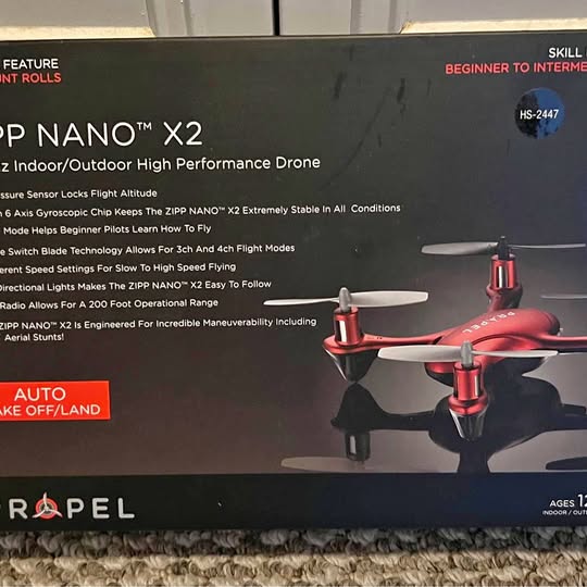 Red and gray quadcopter drone with four propellers