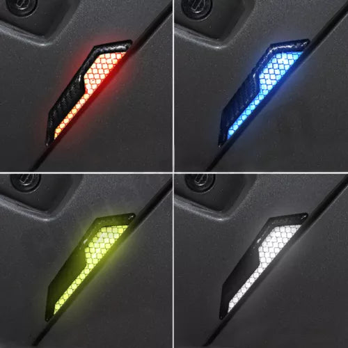 Diecast toy car with LED lights, showing red, blue, green, and white illuminated details