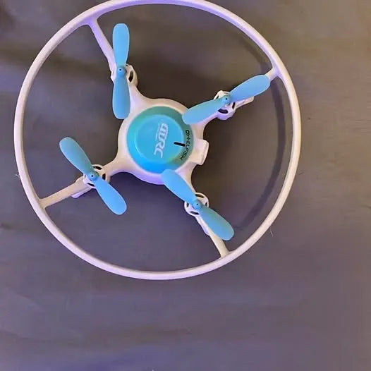 Kids drone with circular ring frame, blue propellers and light purple body