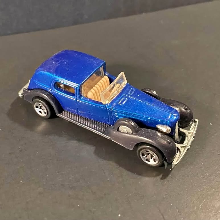 Blue vintage classic diecast car with silver grille and whitewall tires