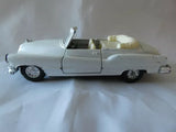 White vintage diecast convertible car toy, Buick-style 1/36 scale, open top.