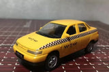 Yellow taxi diecast car model with black checkered stripe, 1:64 scale