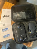 Drone and remote controller in foam-lined hard case with accessories