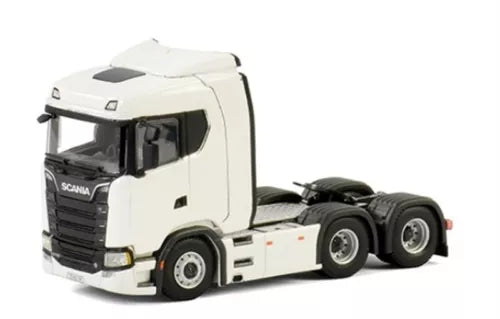 White diecast Scania-style truck cab with black grille and wheels, semi-tractor model