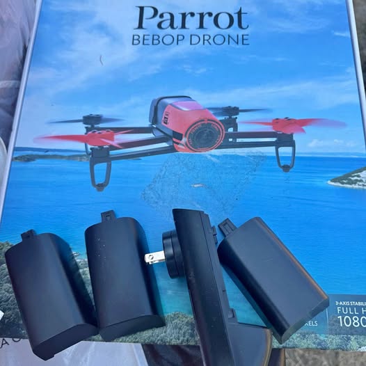 Quadcopter drone with front camera and black battery packs