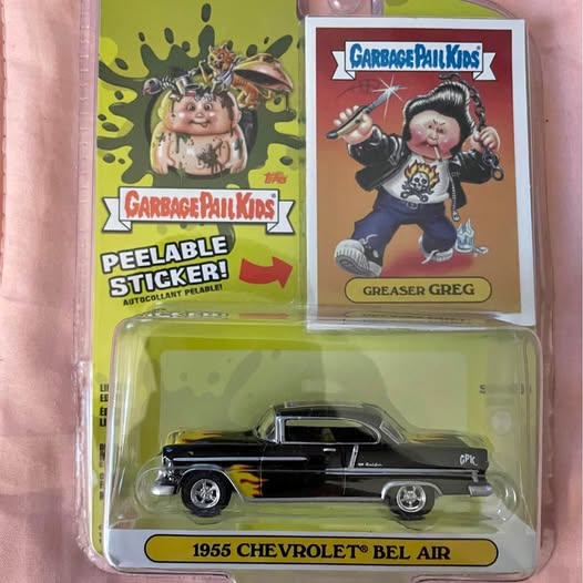 Black 1955 Chevrolet Bel Air diecast car with flame graphics, in Garbage Pail Kids blister pack