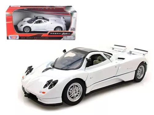 White diecast model sports car with black hood details, front-left 3/4 view