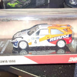 Diecast race car model with yellow, blue, and white livery, REPSOL logo