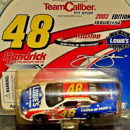 Diecast race car figure in blister pack, red and blue #48