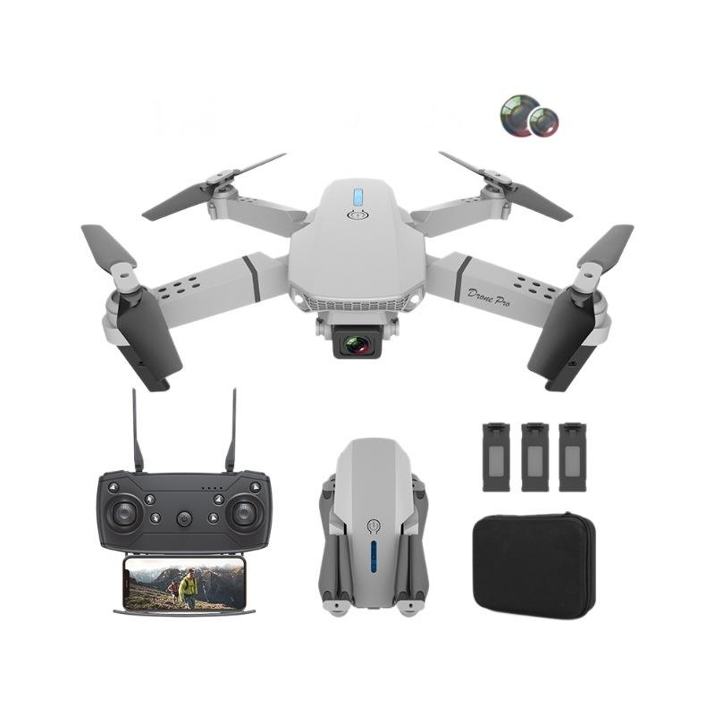 RC quadcopter drone with front camera, foldable propellers and remote controller with screen