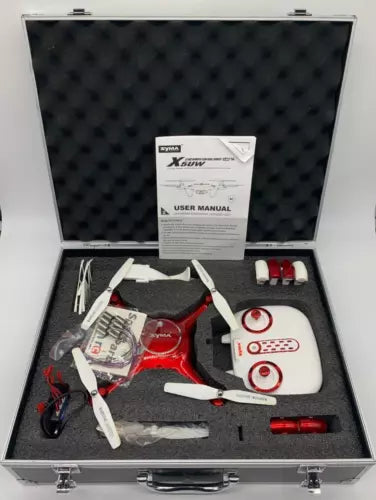 FPV quadcopter drone kit in case with drone body, propellers, and user manual