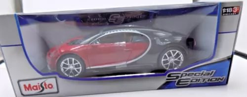 Red and black diecast model car with silver wheels in display box