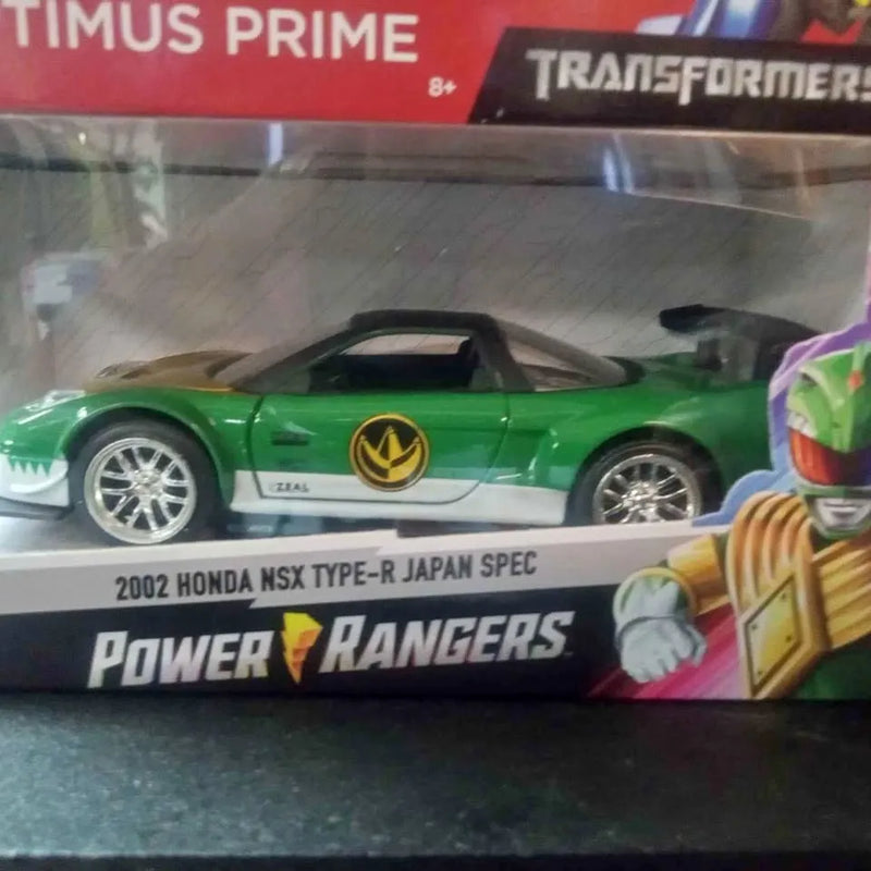Green diecast sports car model with silver wheels and front bumper detail