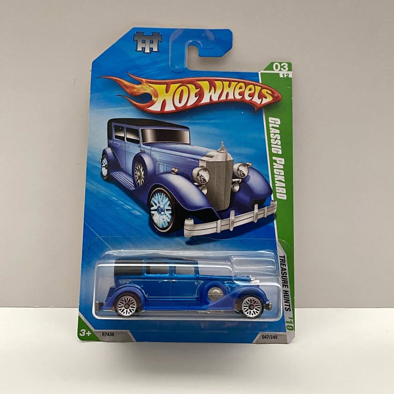 Blue diecast car in blister package, Hot Wheels Treasure Hunt series, 03/12