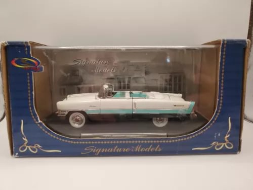 White diecast vintage car in blue Signature Models display box with clear window