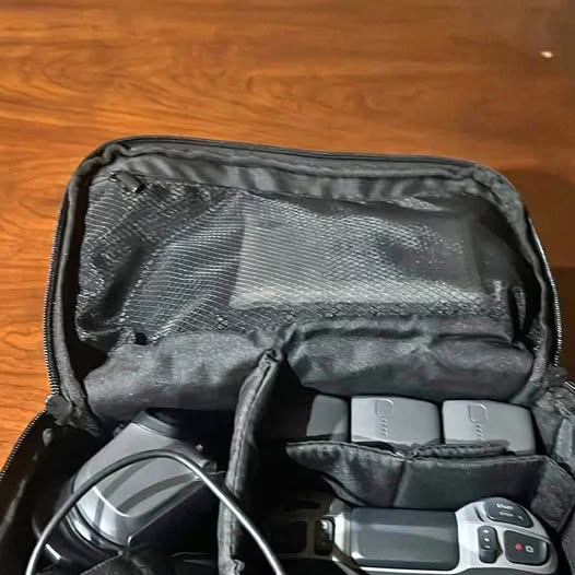 DJI Avata 2 drone in open carrying case with controller and cables