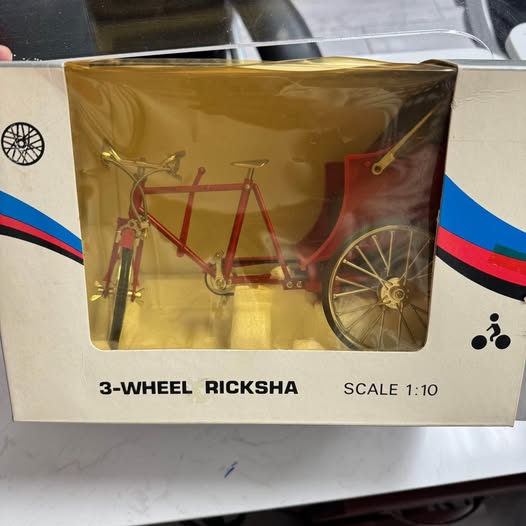 Diecast 3-wheel ricksha bike model in box, red frame and spoked front wheel