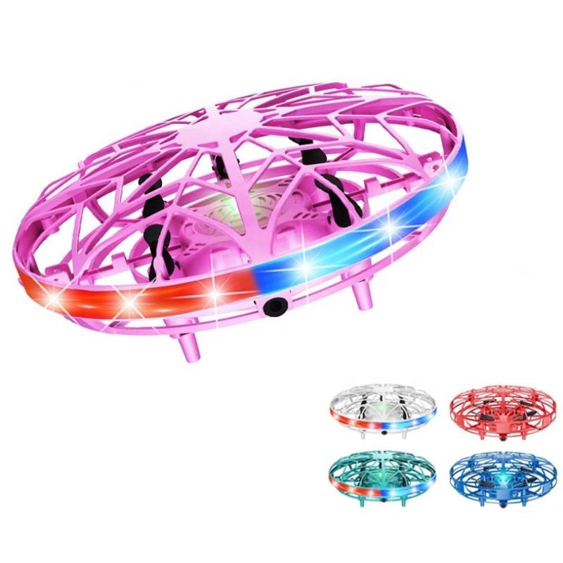Pink RC toy drone with open lattice frame and blue/red LED lights, 3-axis gyro