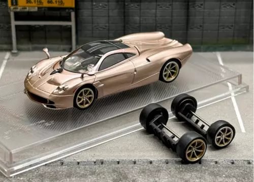 Beige Pagani Huayra Long Tail 1/64 diecast car model with replacement wheels