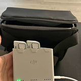 DJI battery pack with charging terminals on black case