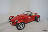 Red diecast roadster car, front three-quarter view with silver wheels