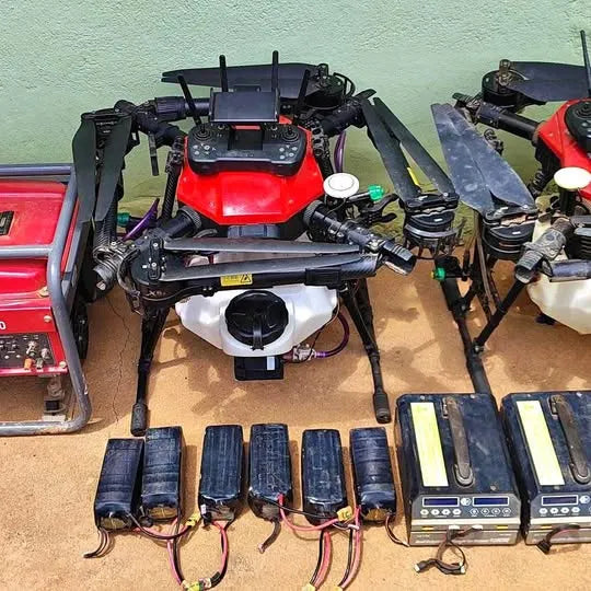 Agricultural drone with red body, black frame and multiple arms, plus sensor modules