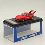 Red diecast model car with rear tall wing, on display base, 1:64 scale