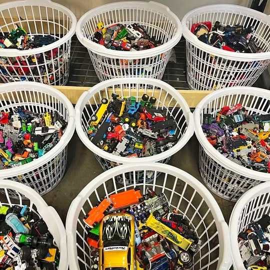 Diecast car and truck grab bag: assorted toy vehicles in white wire baskets