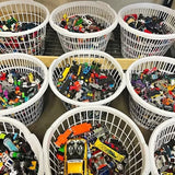 Diecast car and truck grab bag: assorted toy vehicles in white wire baskets