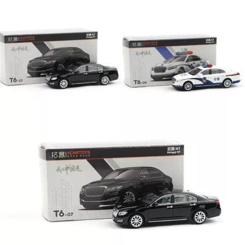 Diecast model car in box, black sedan with silver wheels, front view and packaging