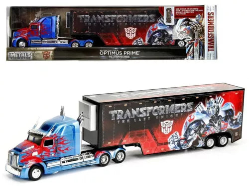 Die-cast toy truck with blue cab and red trailer, Optimus Prime Transformers graphics